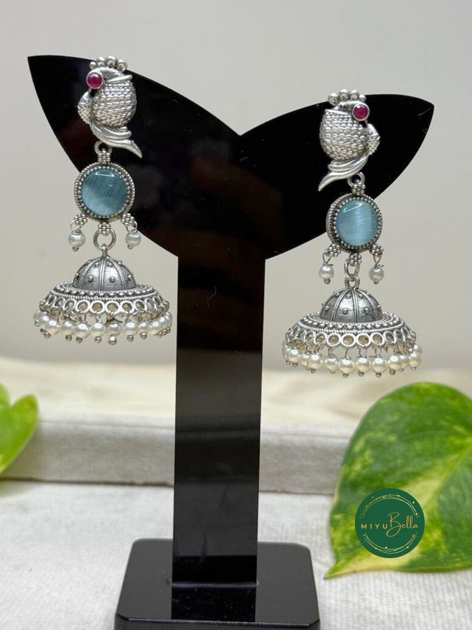 Kanak – Silver Finish Jhumkas with Pearls and Blue Stone Accents