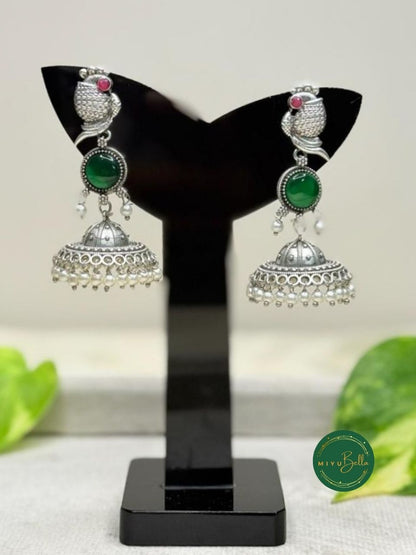 Kanak – Silver Finish Jhumkas with Pearls and Green Stone Accents