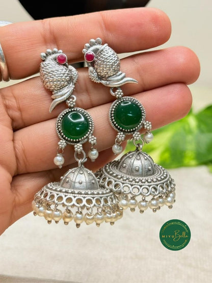 Kanak – Silver Finish Jhumkas with Pearls and Green Stone Accents